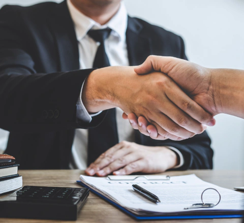 appraiser shkaing hands with his client after signing the contract raleigh nc